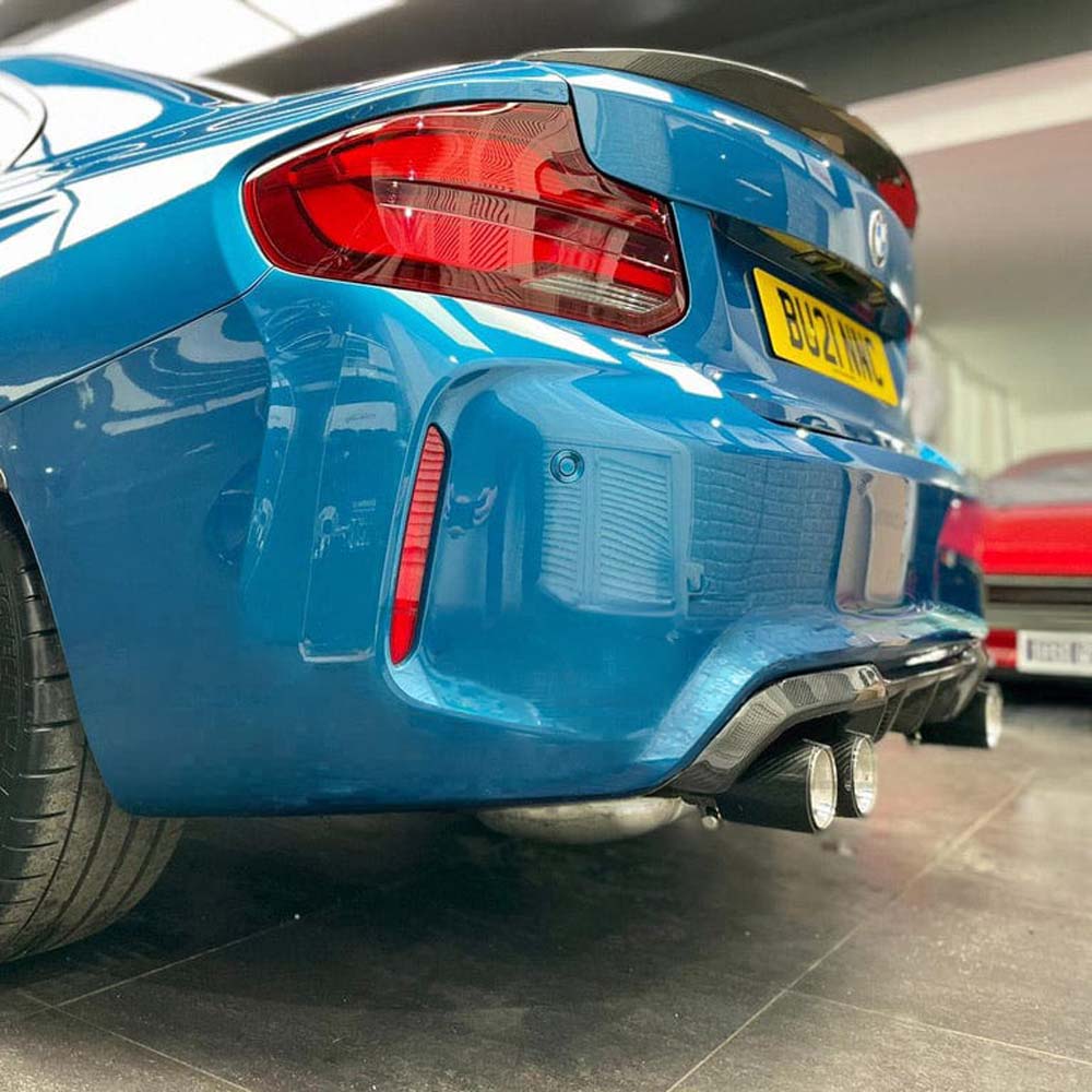 BMW M2 F87 full carbon fiber kit by CT Carbon, including aerodynamic body panels and accents, showcasing a sleek, lightweight design.