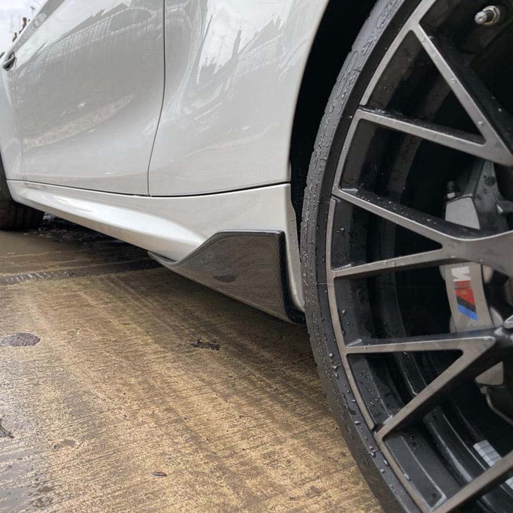 BMW M2 F87 full carbon fiber kit by CT Carbon, including front splitter, side skirts, and rear diffuser, displayed on the car.
