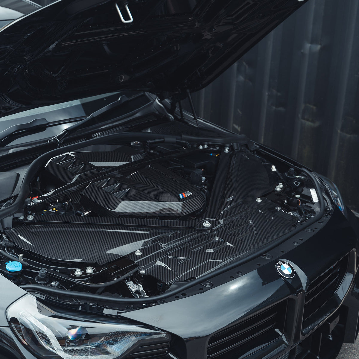 BMW M2 M3 M4 G87 G80 G81 G82 G83 Carbon Fibre Engine Strut Brace by CT Carbon, showing the lightweight, durable automotive accessory.