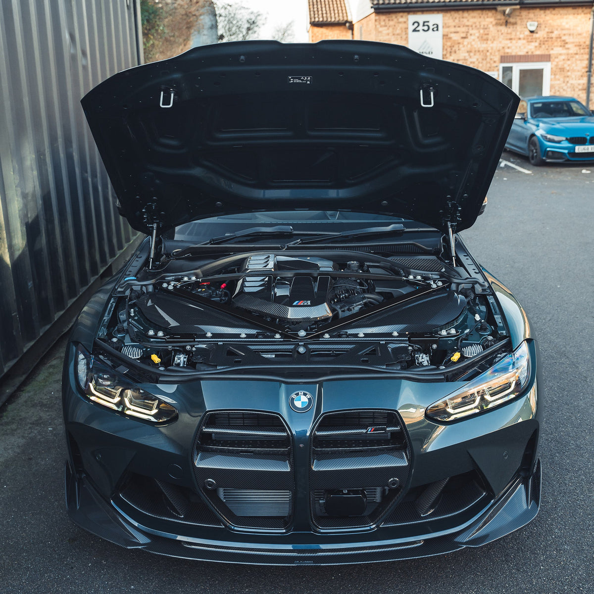 BMW M2, M3, M4 G87/G80/G81/G82/G83 carbon fiber slam panel replacement by CT Carbon, close-up view of the lightweight accessory.