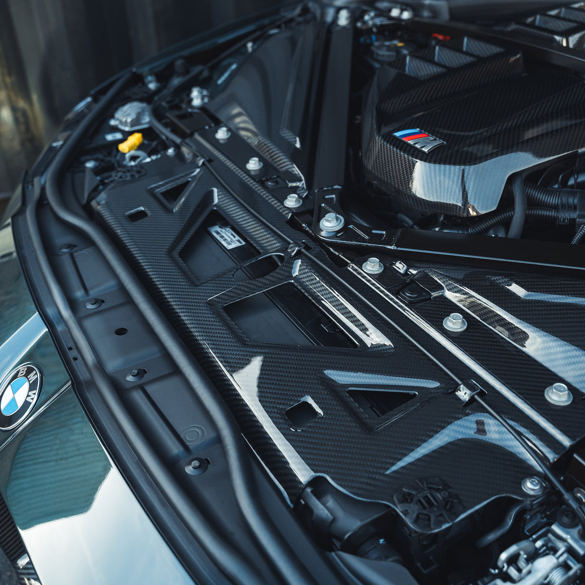 BMW M2, M3, M4 G87, G80, G81, G82, G83 carbon fibre slam panel replacement by CT Carbon, showcasing sleek, lightweight automotive accessory.