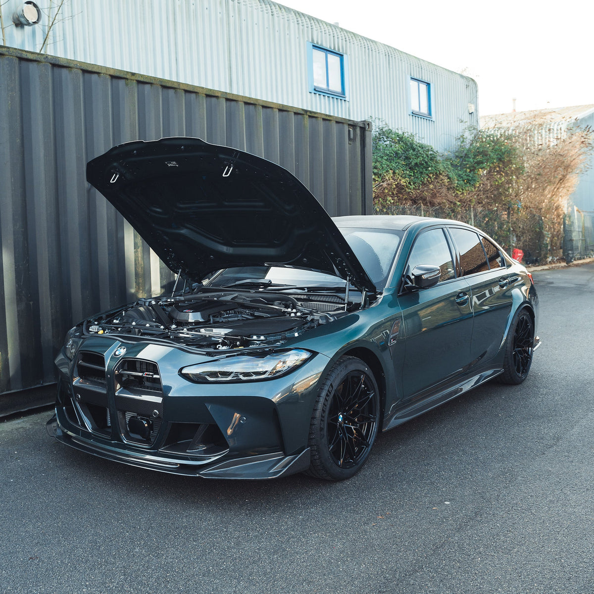 BMW M2, M3, M4 G87, G80, G81, G82, G83 carbon fiber slam panel replacement by CT Carbon, showing the lightweight panel.