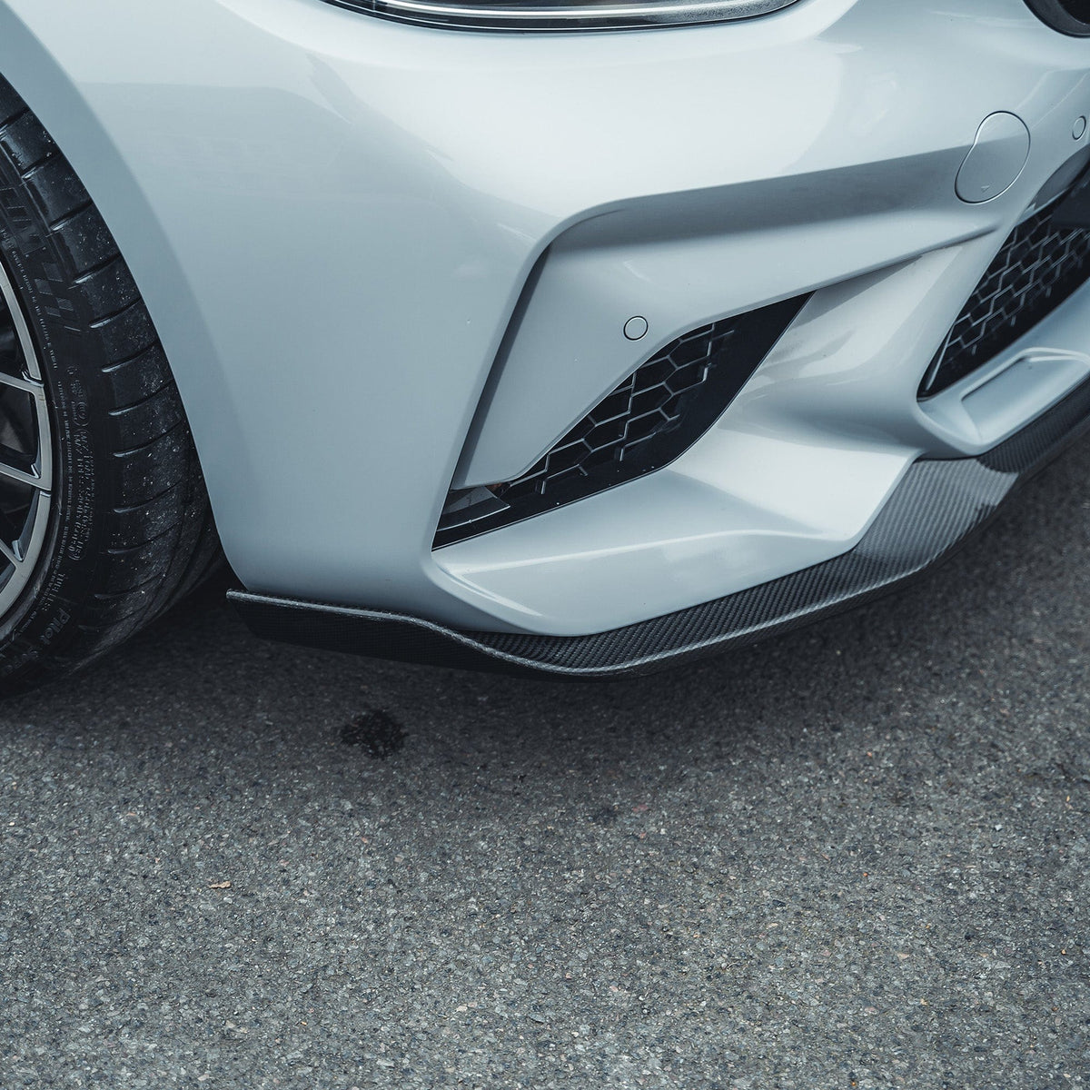 BMW M2C F87 full carbon fiber kit by CT Carbon, featuring a V3 design with carbon fiber components on the car.
