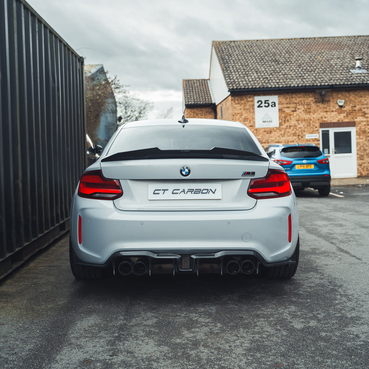 BMW M2 M2C F87 carbon fiber diffuser by CT Carbon, showcasing the aggressive V6 design with detailed carbon fiber finish.