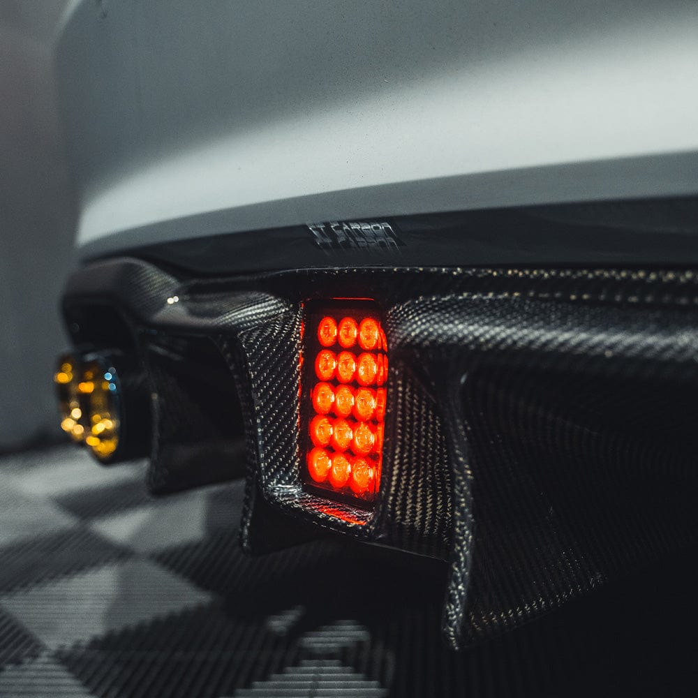BMW M2 F87 carbon fibre diffuser by CT Carbon, featuring an aggressive V6 design for improved aerodynamics.