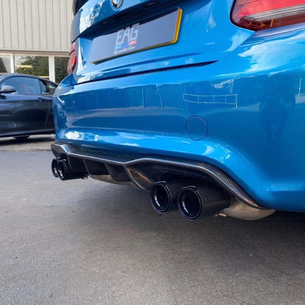 BMW M2 F87 carbon fibre diffuser by CT Carbon, V1 style, showcasing sleek aerodynamic design and high-quality carbon fiber finish.