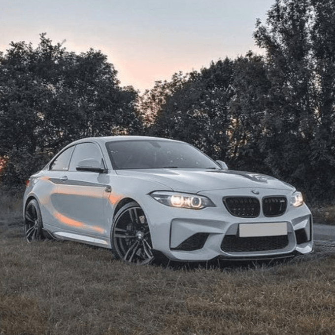 BMW M2 F87 carbon fiber middle splitter by CT Carbon, designed for aerodynamic performance and sporty look.