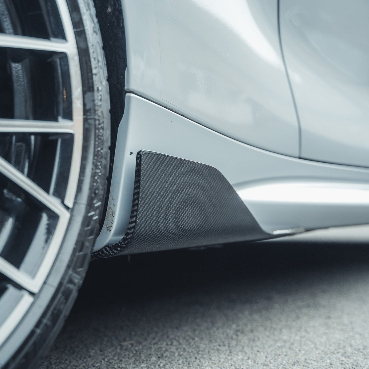 BMW M2 F87 carbon fibre side skirts by CT Carbon, V1 style, featuring sleek aerodynamic design and high-quality finish.