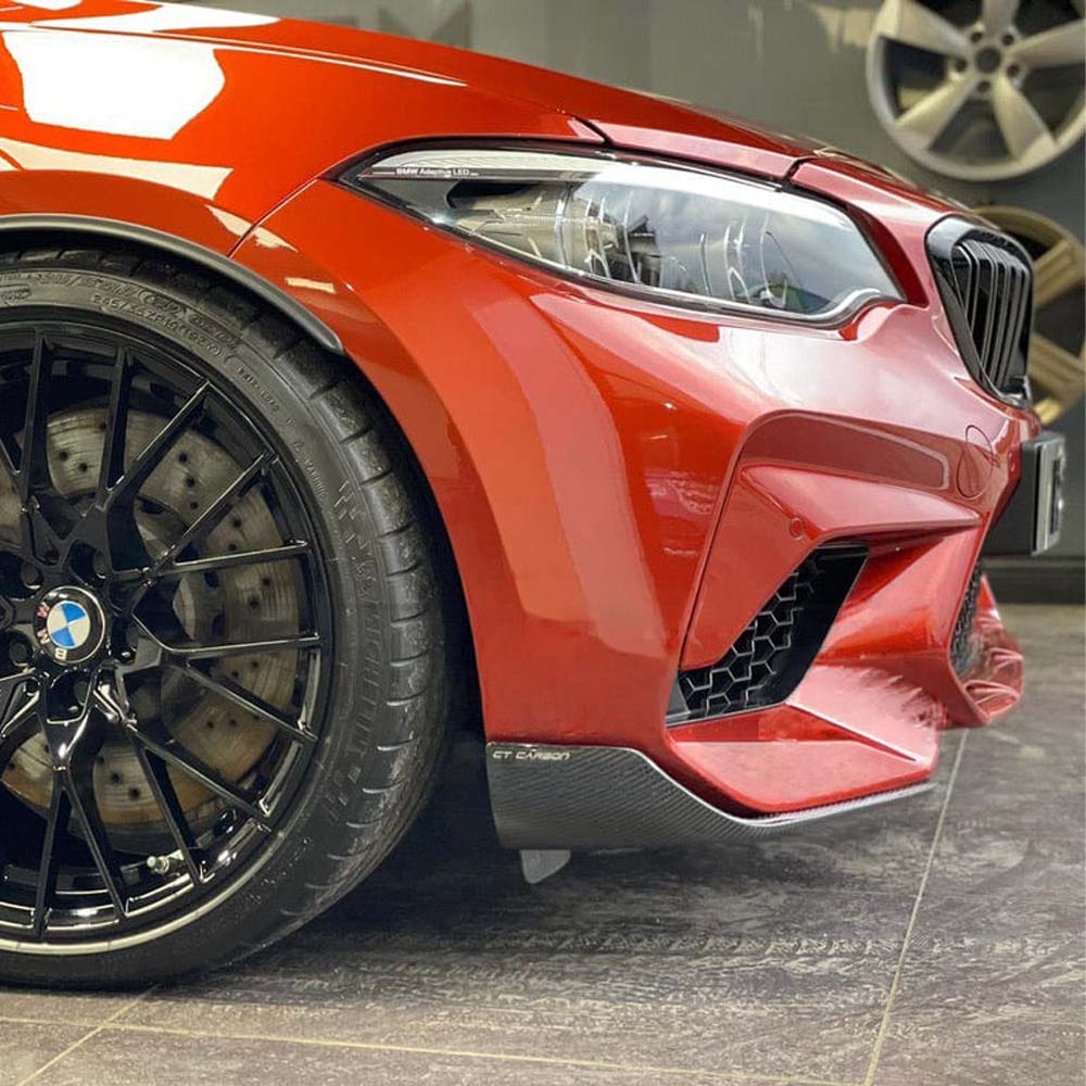 BMW M2 F87 carbon fiber splitter by CT Carbon, V1 style, showing sleek aerodynamic design on the front of the car.