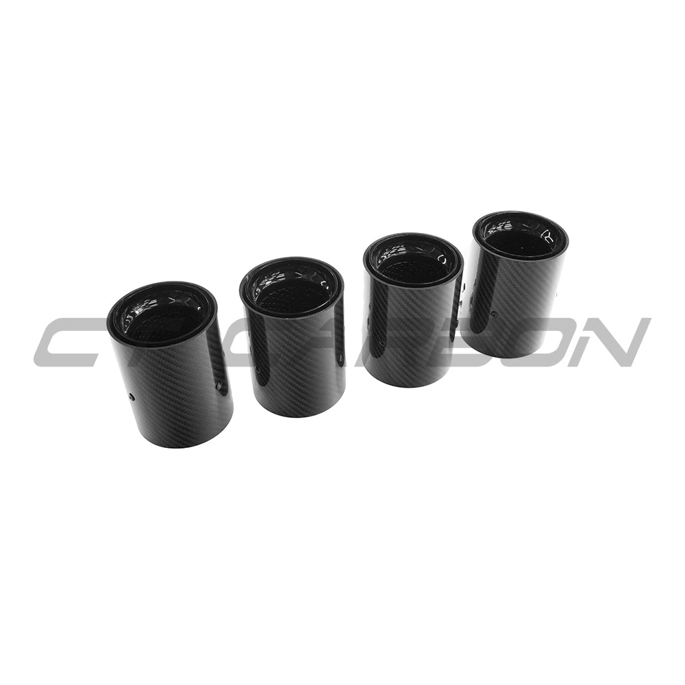 Set of four black carbon fibre exhaust tips for BMW M2, M3, M4, M5, F10, F80, F82, F83, F87 models by CT Carbon.