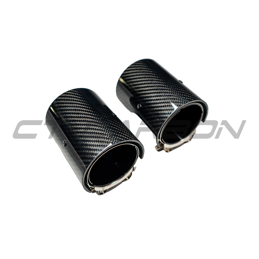 Set of four black carbon fiber exhaust tips for BMW M series F10, F80, F82, F83, F87 models by CT Carbon, designed for sporty appearance