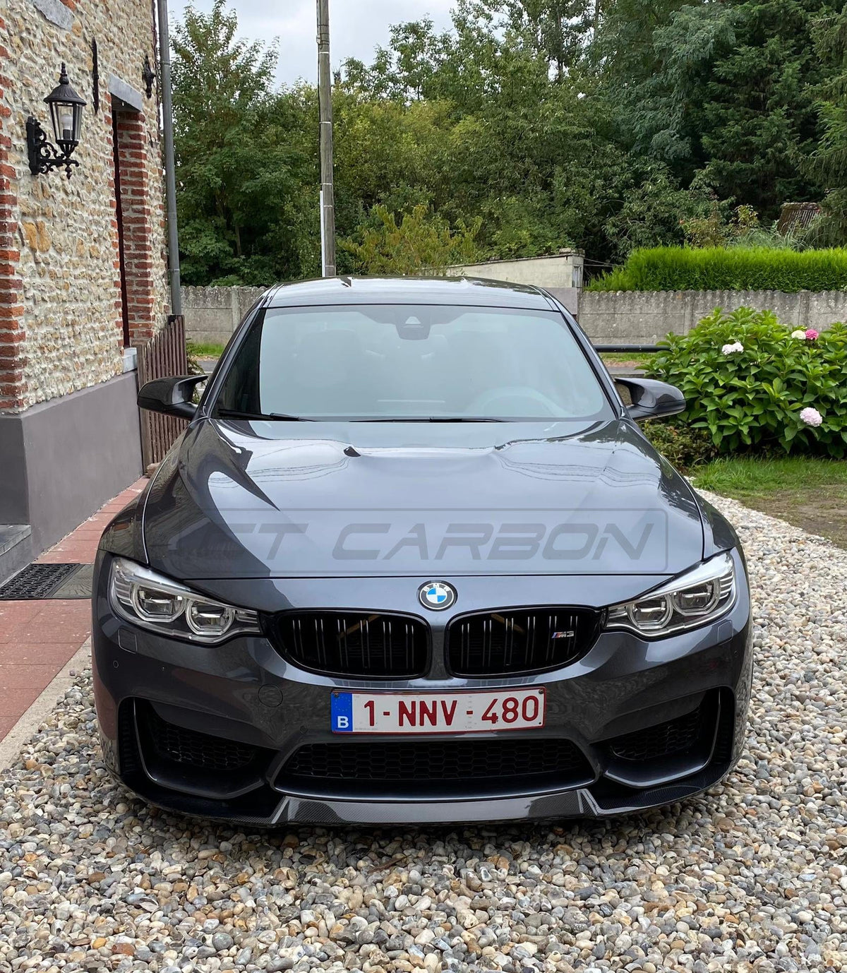 BMW M3 F80 full carbon fiber kit by CT Carbon, featuring CS style components, shown on the car in a detailed side view.