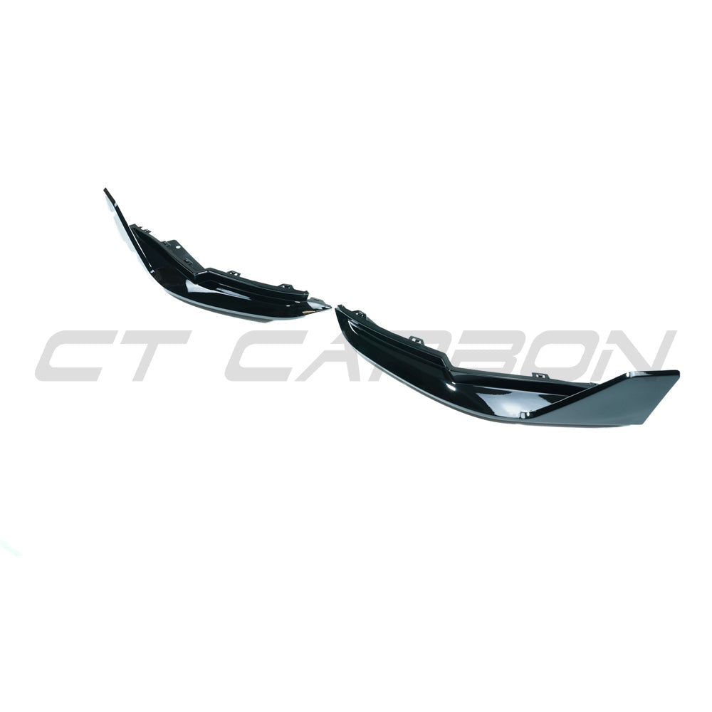 BMW M3 G80 G81 gloss black rear bumper corner accessories by CT Carbon, showing sleek, high-quality automotive detail.
