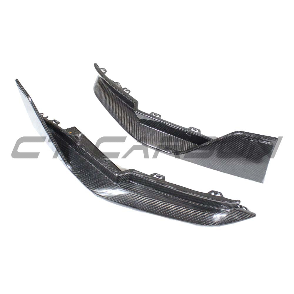 BMW G80 M3 full carbon fibre kit by CT Carbon, showing rear bumper corners with carbon fibre finish and MP-style design.