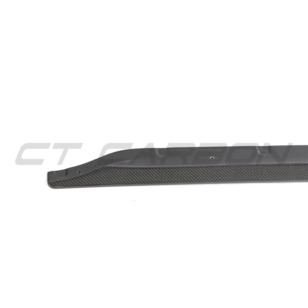 BMW M3 G80 G81 carbon fiber side skirt extensions by CT Carbon, showcasing sleek, lightweight aerodynamic enhancements.