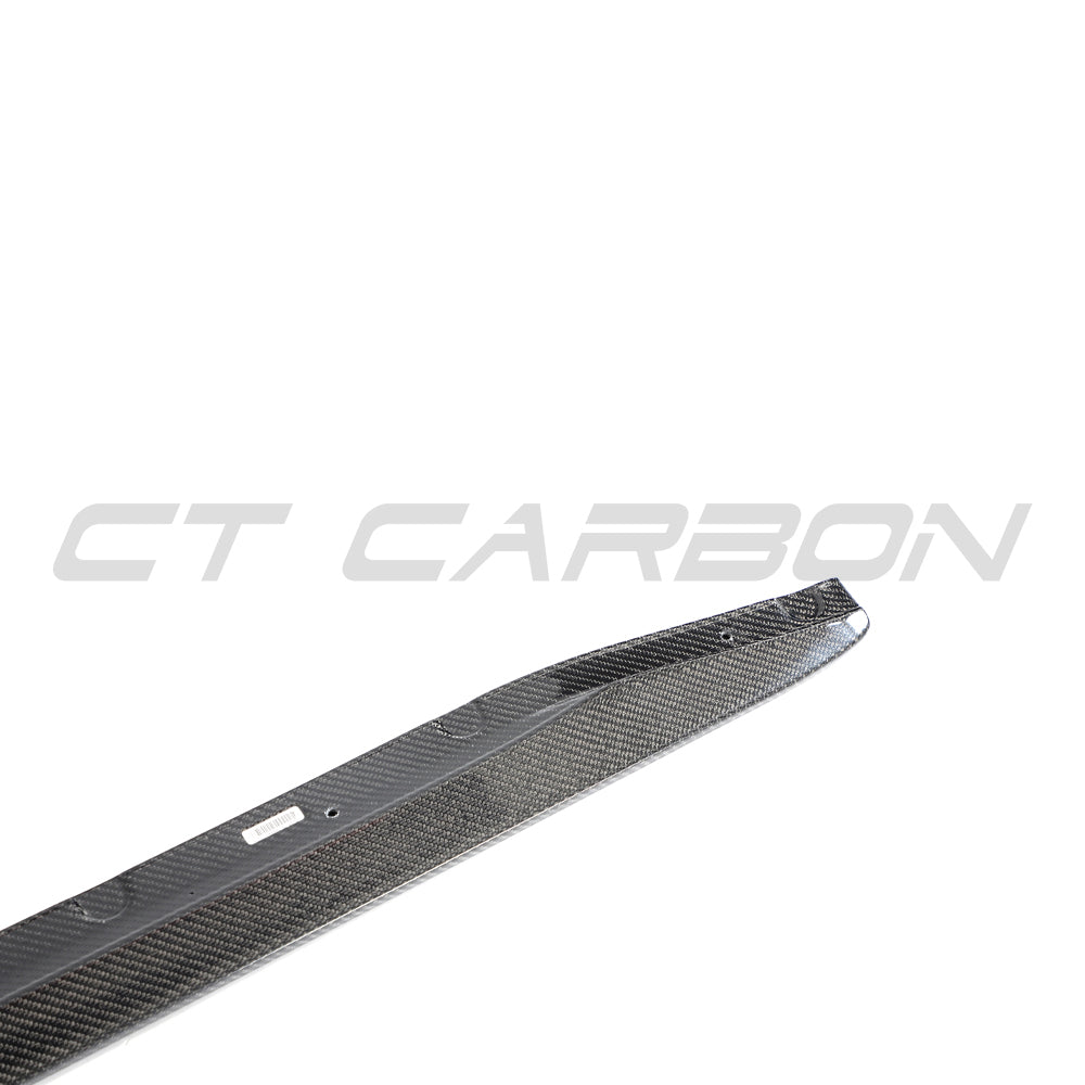 BMW M3 G80 G81 carbon fibre side skirt extensions by CT Carbon, showing sleek, lightweight side skirts with detailed carbon fiber finish.