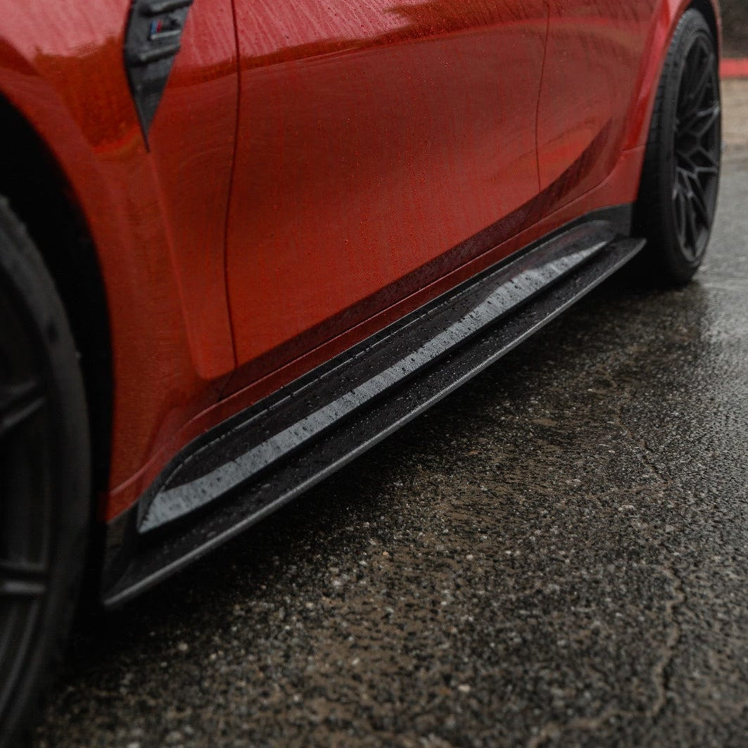 BMW M3 G80 G81 carbon fibre side skirt replacement and extension by CT Carbon, showcasing sleek, lightweight aerodynamic design.