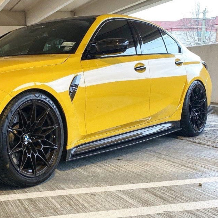 BMW M3 G80 G81 carbon fibre side skirt replacement and extension by CT Carbon, showcasing sleek, lightweight automotive side skirts.