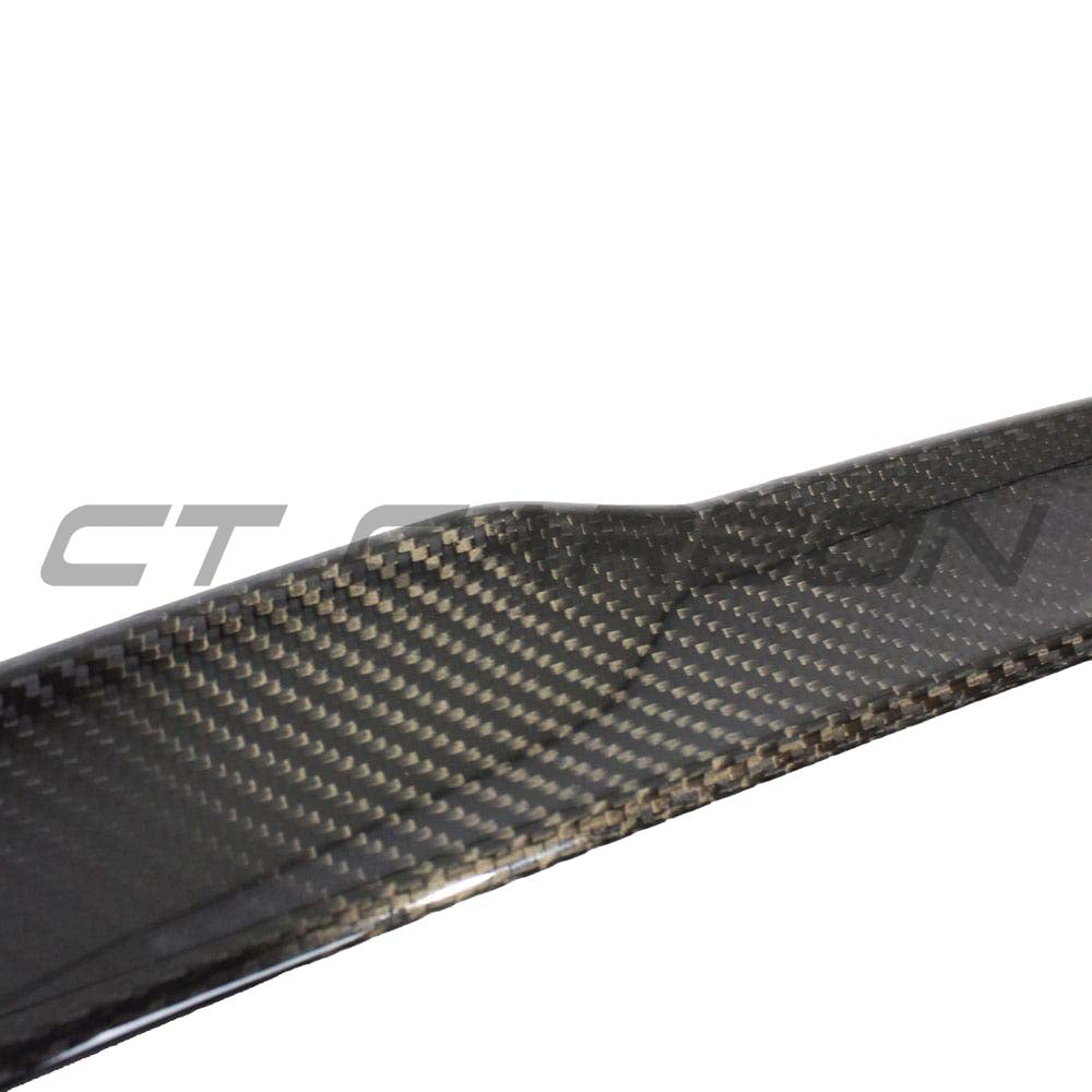 BMW M4 G82 G22 carbon fibre spoiler by CT Carbon, showcasing its sleek MP-style design on the sporty vehicle.