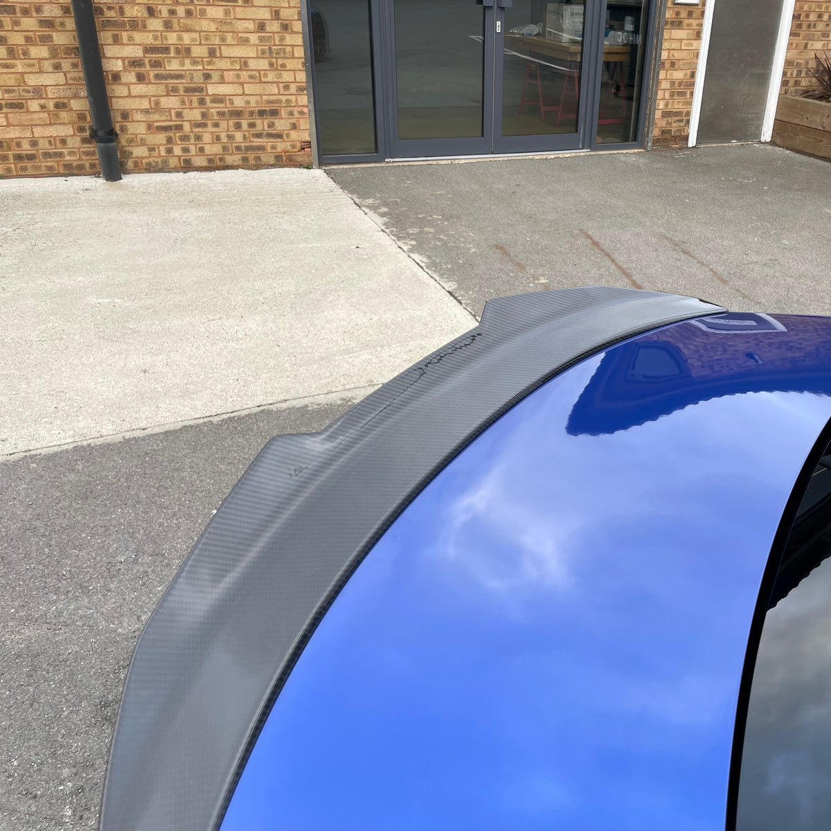 BMW M3 G80 and 3 Series G20 carbon fiber spoiler by CT Carbon, V2 style, showcasing sleek aerodynamic design.