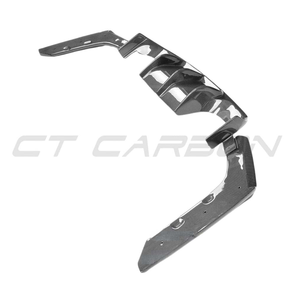 BMW M3 F80 saloon full carbon fibre kit by CT Carbon, featuring diffuser and V-style accents on a sleek car.