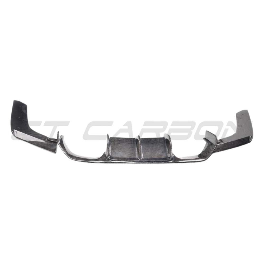 BMW M3 F80 saloon full carbon fibre kit by CT Carbon, featuring diffuser and V-style accents on a sleek black car.