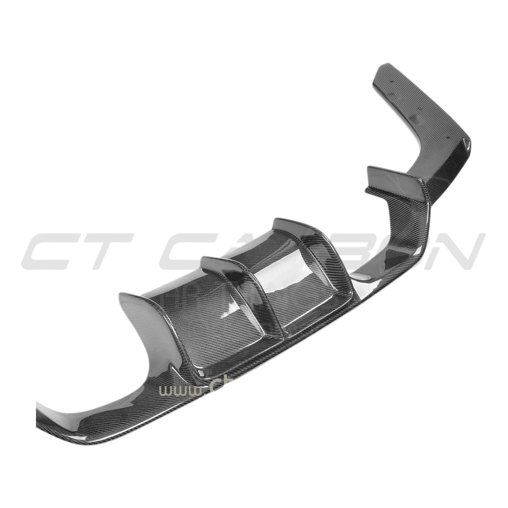 BMW M3 M4 F80 F82 F83 carbon fiber diffuser by CT Carbon, V2 style, showcasing sleek aerodynamic design and carbon fiber finish.