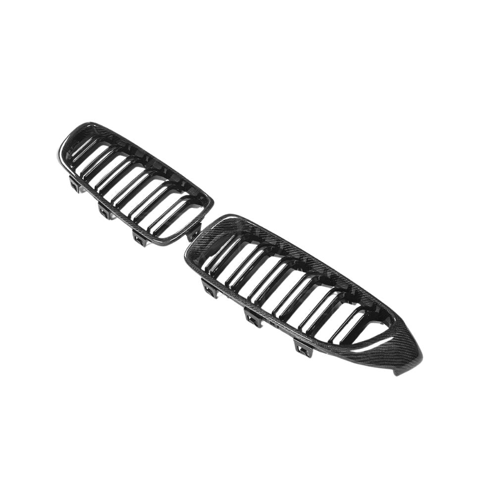 BMW M3 M4 F80 F82 F83 carbon fiber front grille by CT Carbon, showcasing sleek black carbon fiber design on the vehicle.