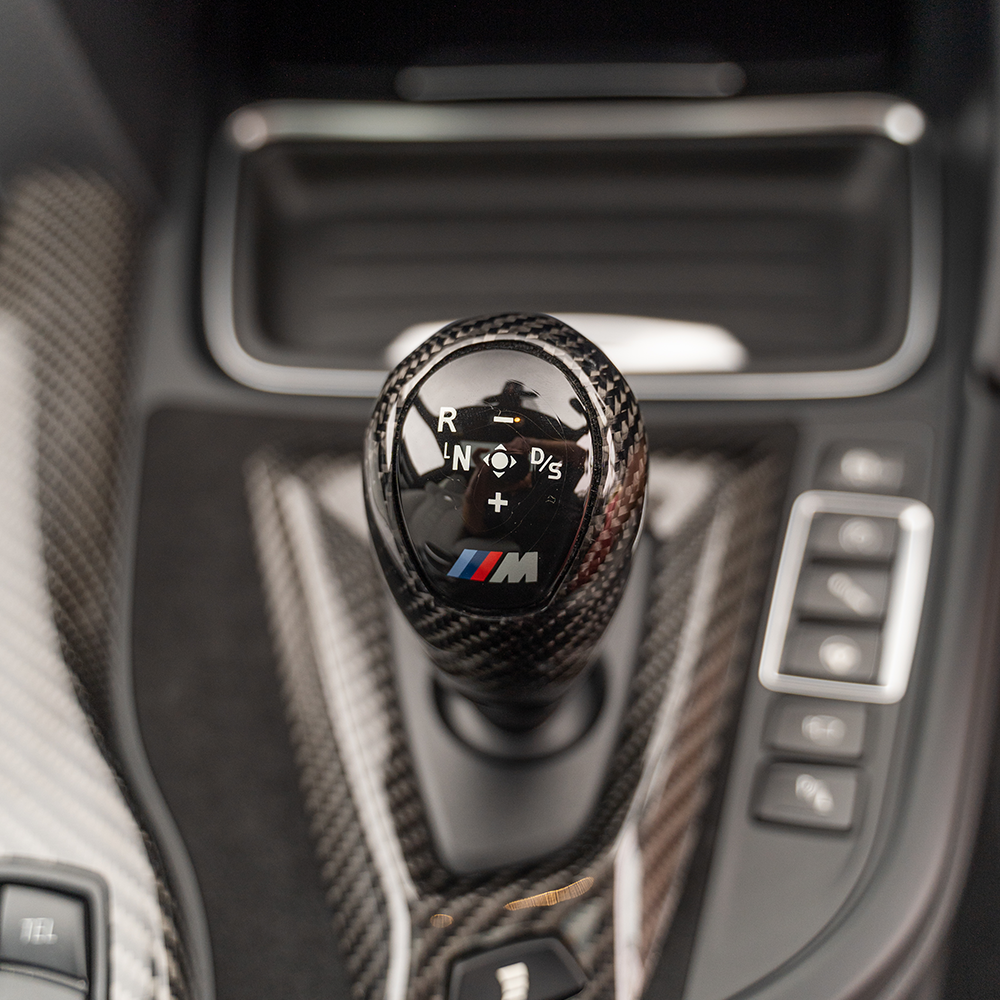 BMW M series F80 F82 F83 F87 carbon Alcantara shift knob and surround accessory by CT Carbon, right-hand drive, detailed interior view