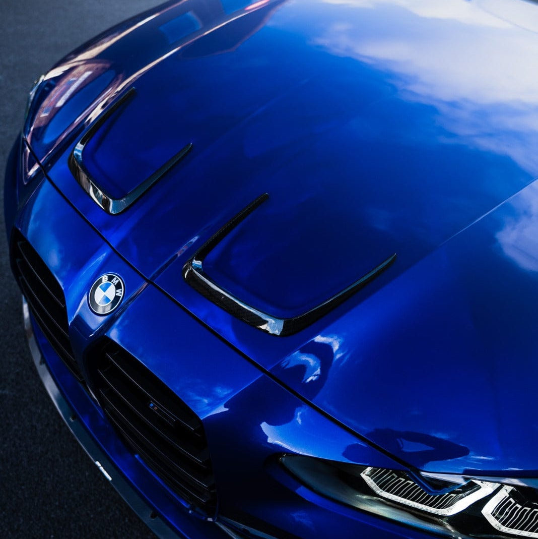 BMW M3 M4 G80 G82 G81 G83 carbon fiber bonnet hood trims by CT Carbon, close-up view of sleek, lightweight accessories.
