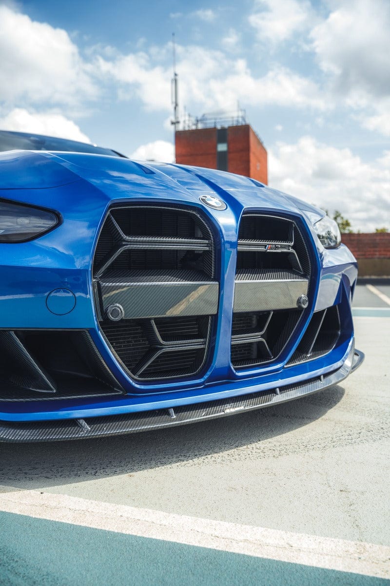 BMW M3 M4 G80 G81 G82 G83 carbon fiber front end pack by CT Carbon, showcasing the sleek, lightweight hood and front bumper details.