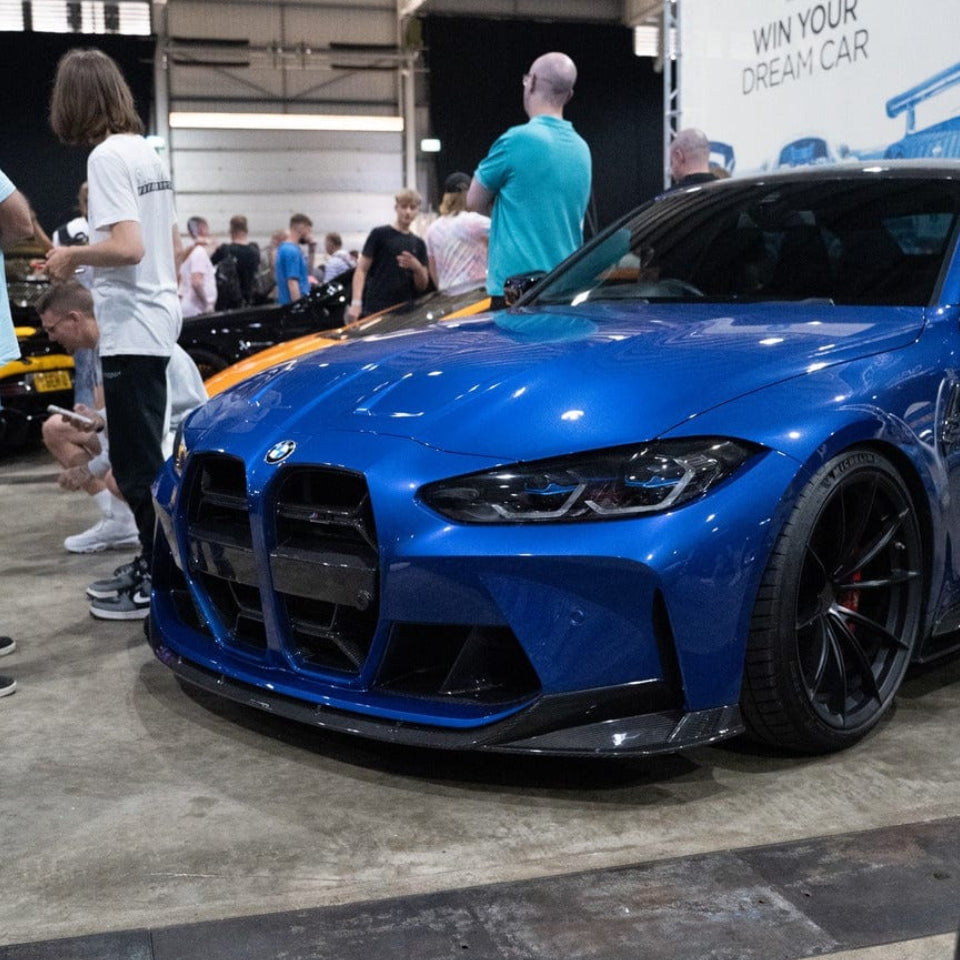 BMW M3/M4 G80 G82 carbon fibre front end pack from CT Carbon, showing sleek aerodynamic front bumper and carbon fiber details.
