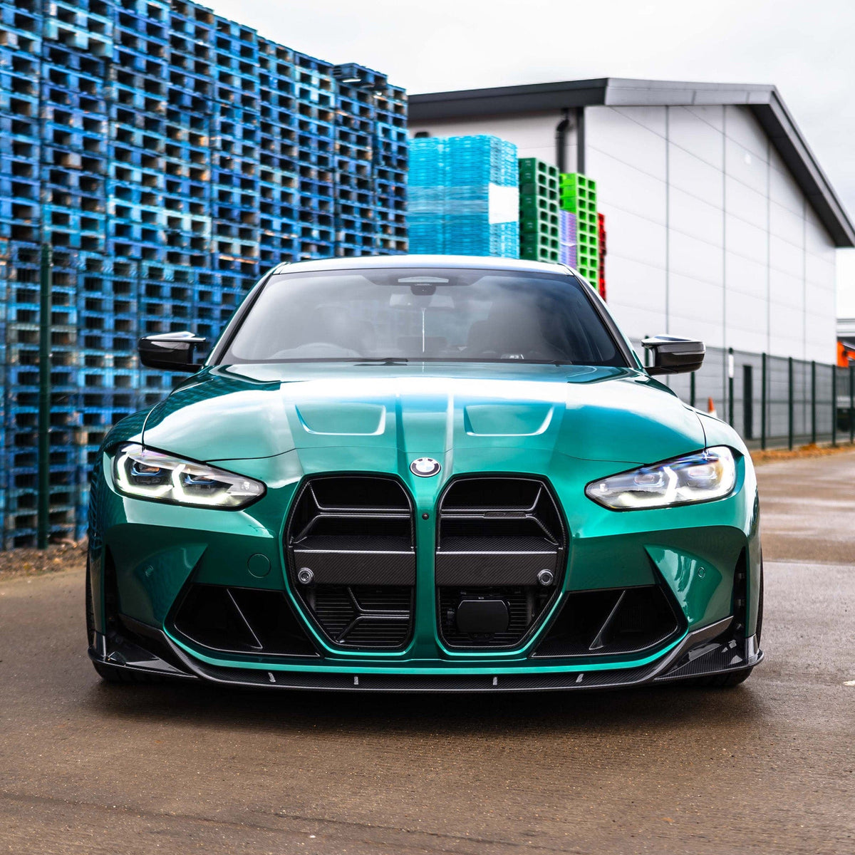BMW M3 M4 G80 G81 G82 G83 carbon fibre splitter by CT Carbon, showing the sleek V2 split design on the front of the car.