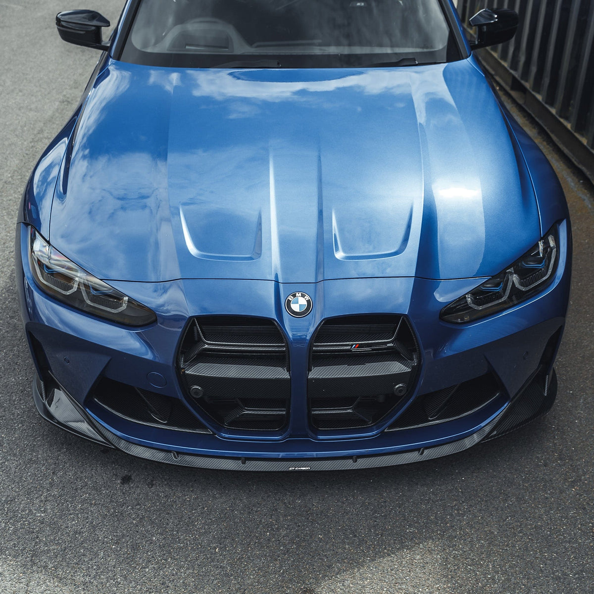 BMW M3 and M4 G80 G82 G83 carbon fibre splitter by CT Carbon, showcasing the sleek, lightweight aerodynamic design.
