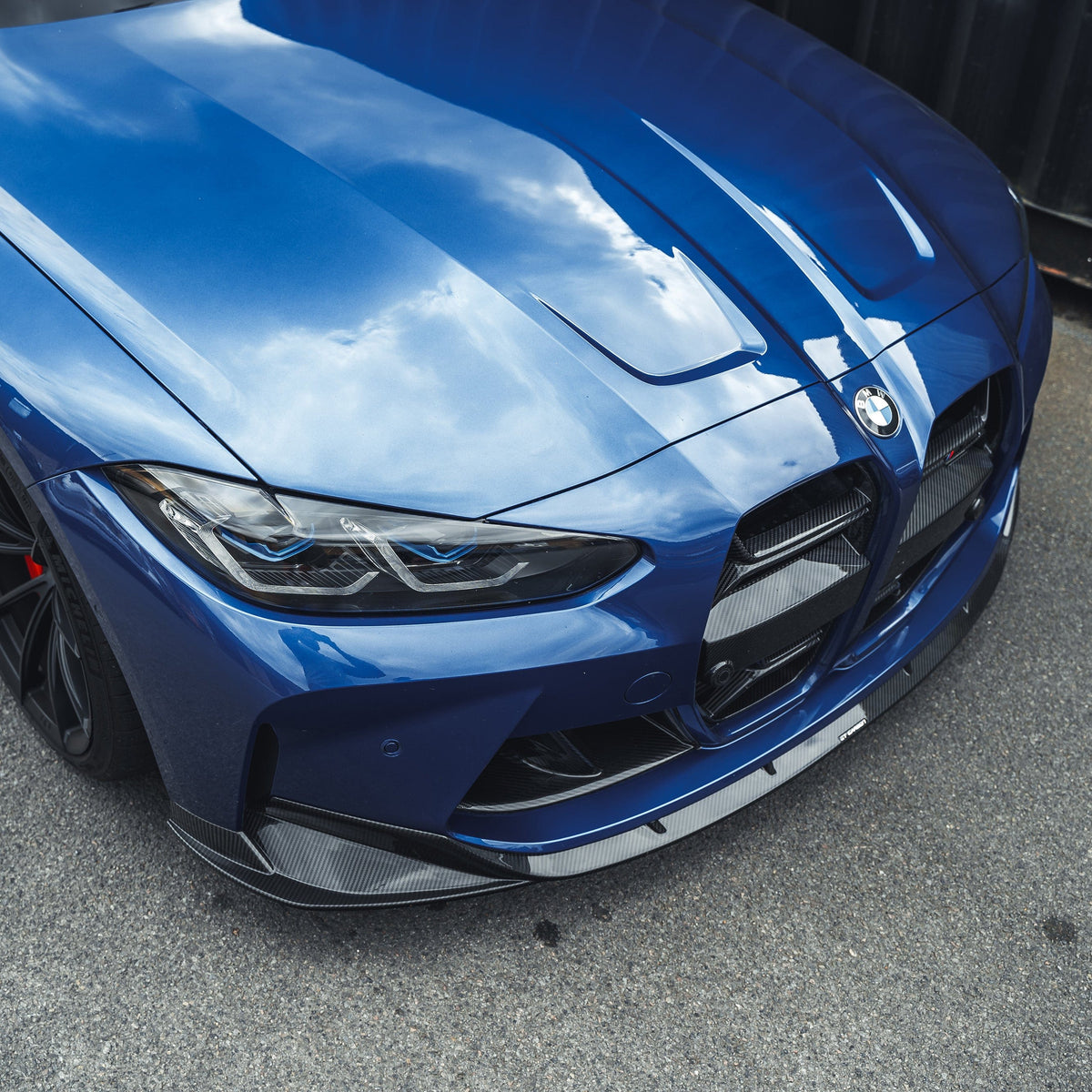 BMW M3 M4 G80 G81 G82 G83 CT Carbon fiber splitter, V2 style, showing sleek black aerodynamic front splitter for performance cars.