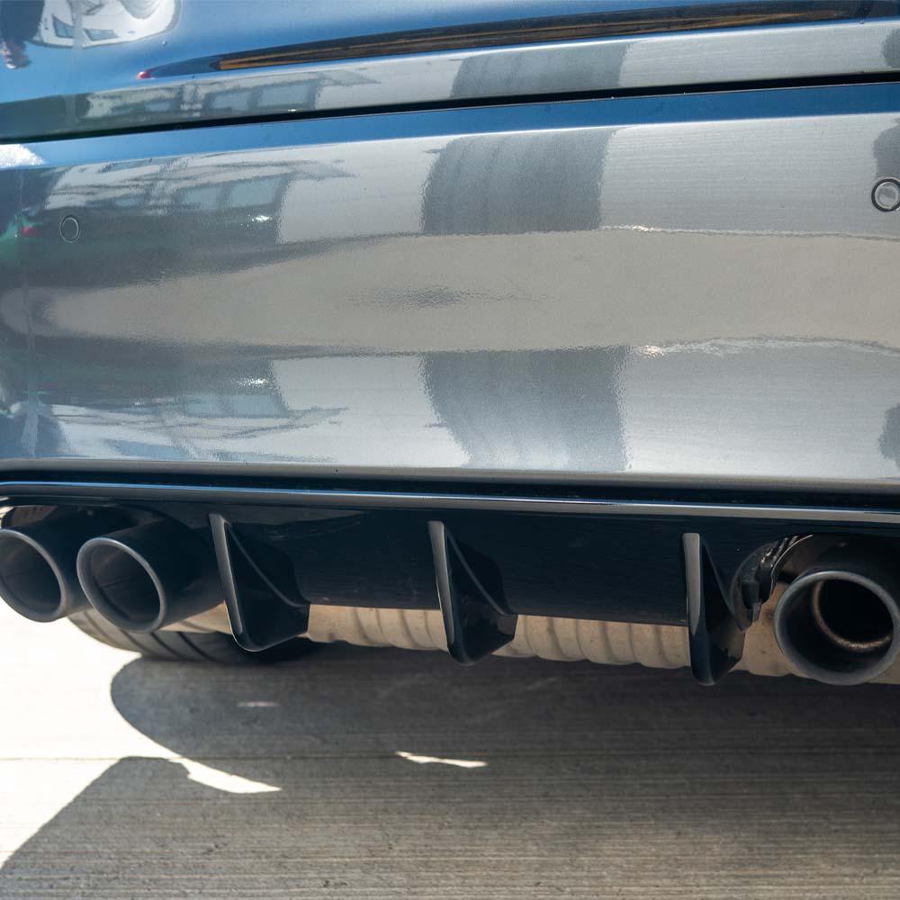 BMW M3 F80 full gloss black kit by CT Carbon, featuring sleek black exterior components on the coupe.