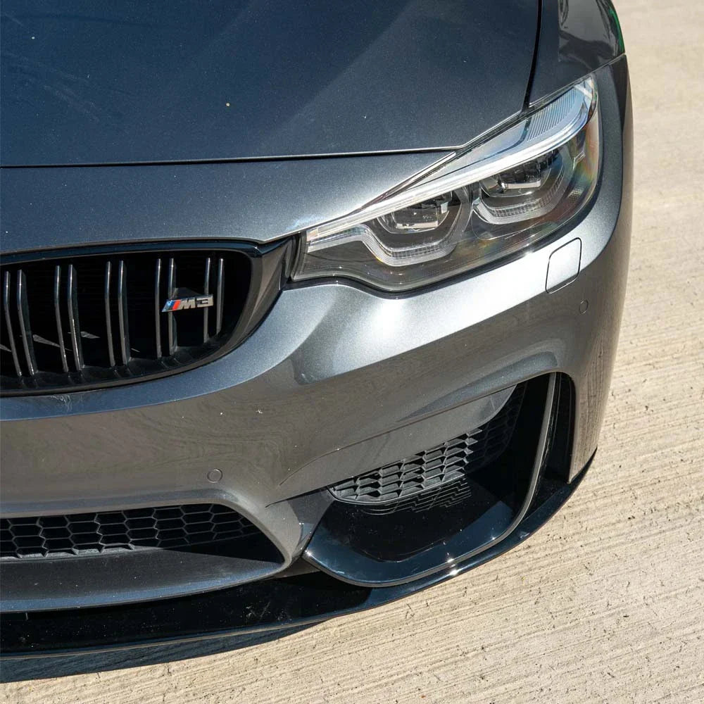 BMW M3/M4 F80 F82 F83 gloss black splitter by CT Carbon, showing the aerodynamic front splitter on a coupe model.