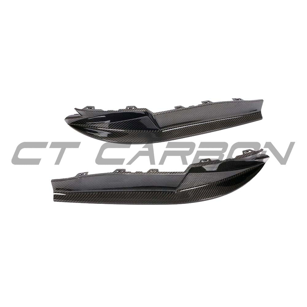 BMW M4 G82 G83 carbon fibre diffuser by CT Carbon, showcasing sleek design and textured finish on the vehicle's rear.