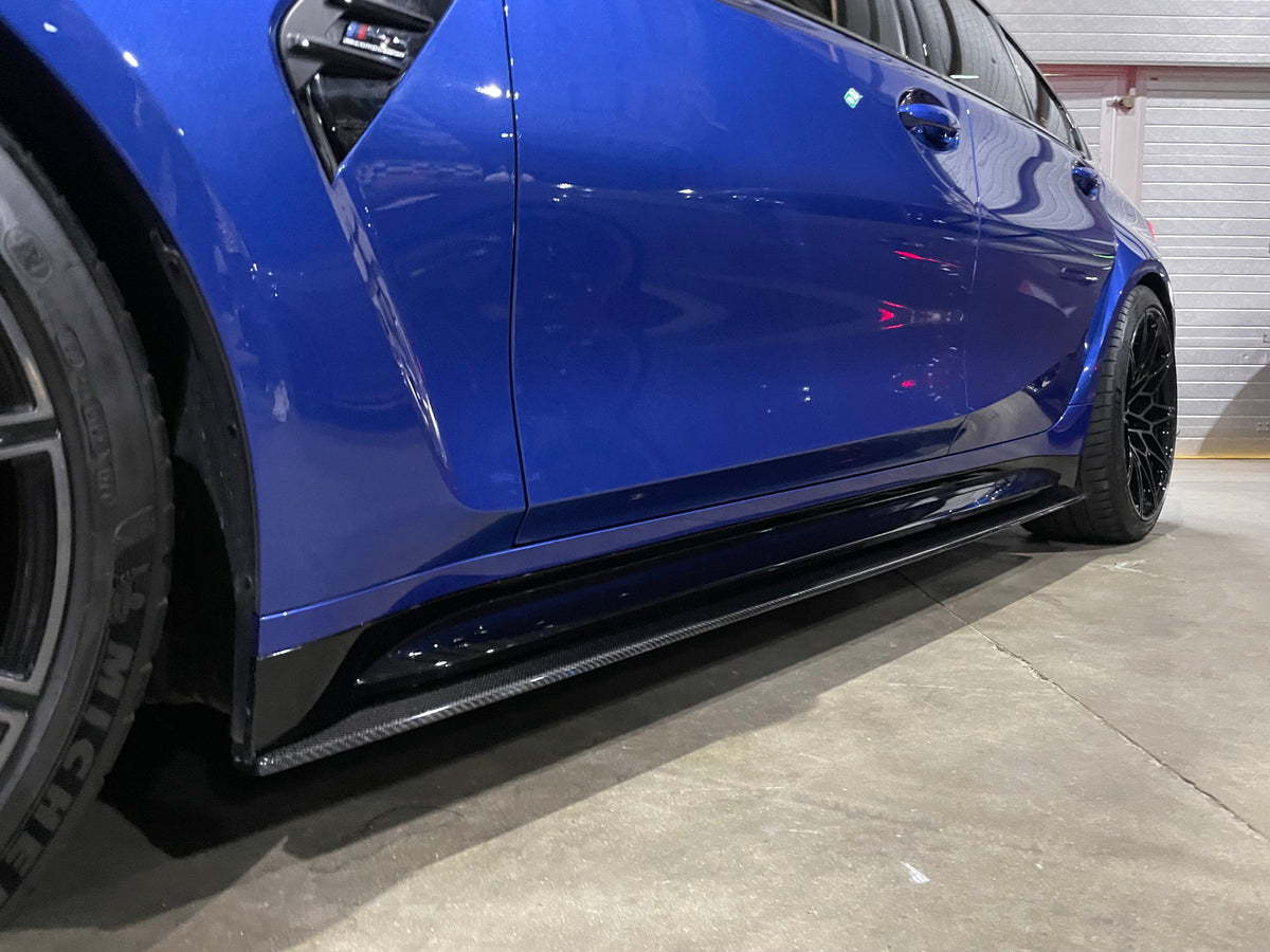 BMW M4 G82 G83 carbon fibre side skirt extensions by CT Carbon, showcasing sleek, lightweight design on the car's side profile.