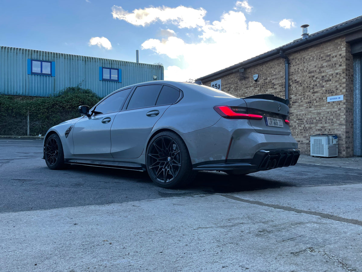 BMW M4 G82 G83 carbon fiber side skirt extensions by CT Carbon, showcasing sleek, lightweight aerodynamic design on the vehicle.
