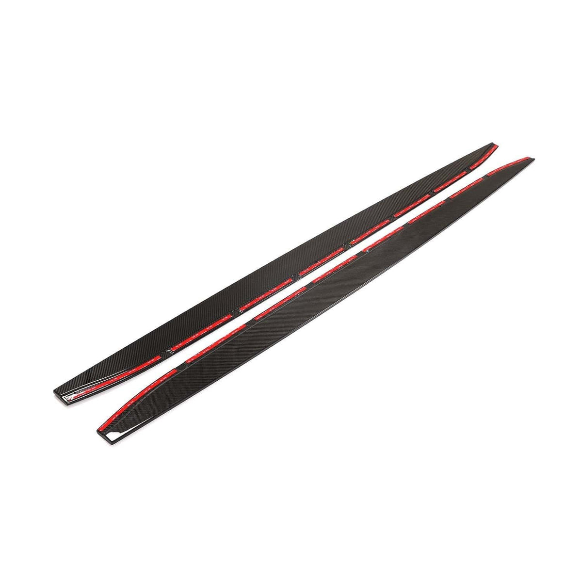 BMW M4 G82/G83 side skirt extensions in carbon fiber by CT Design, showing sleek, aerodynamic styling on the vehicle's side.