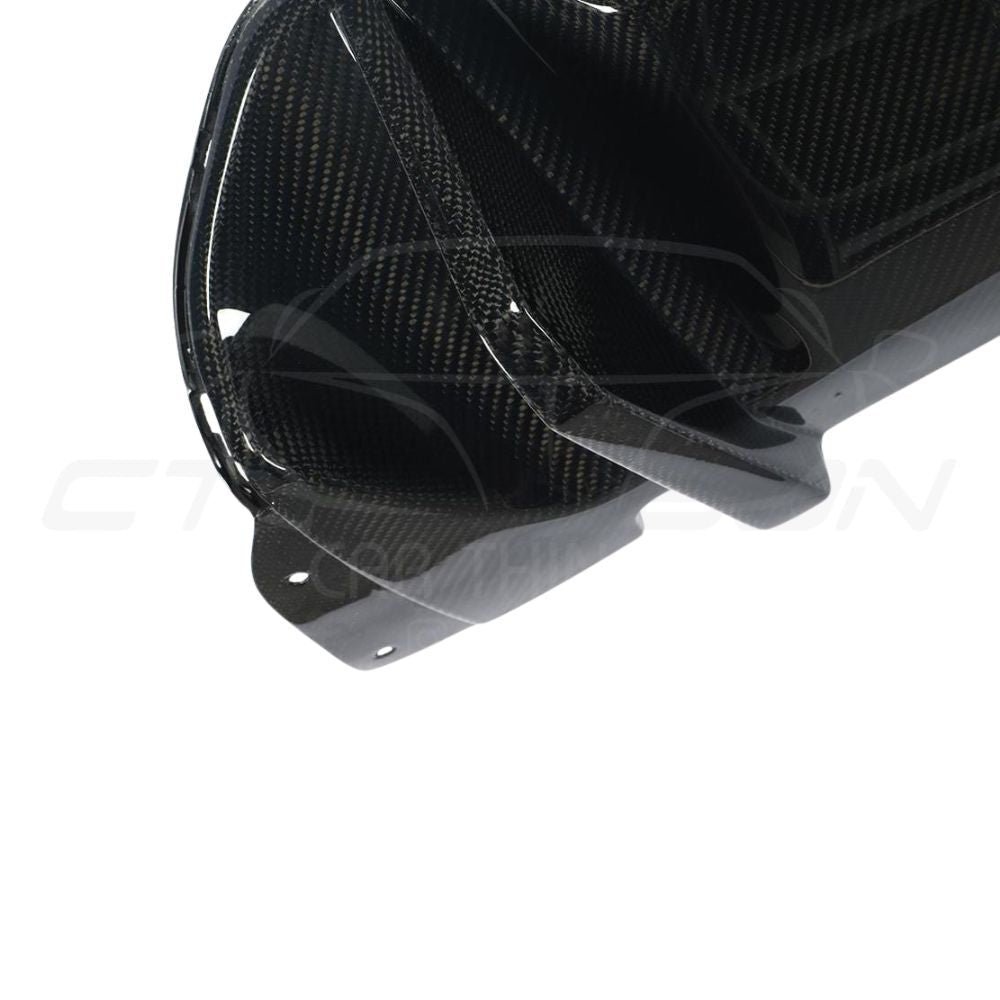 BMW M5 F90 carbon fibre diffuser by CT Carbon, V1 style, showcasing sleek design and high-quality carbon fiber finish.