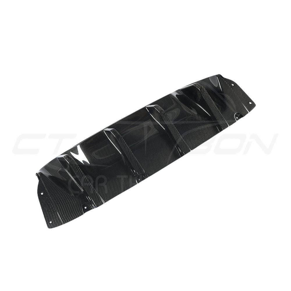 BMW M5 F90 carbon fiber diffuser by CT Carbon, V1 style, showcasing sleek carbon fiber design and aerodynamic features.