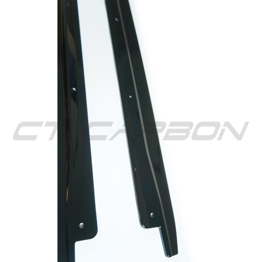 BMW X5 2014-2018 F15 CT Carbon gloss black full-length side skirts installed on vehicle.
