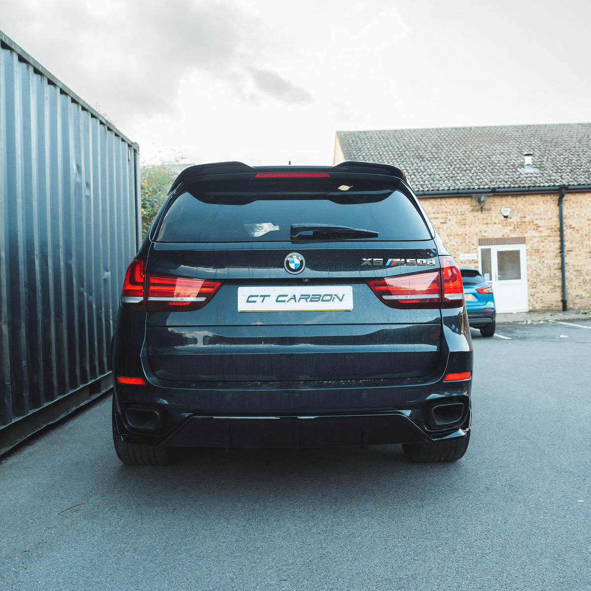 BMW F15 X5 2014-2018 CT Carbon full gloss black kit, including exterior parts, installed on vehicle for a sleek, stylish look.