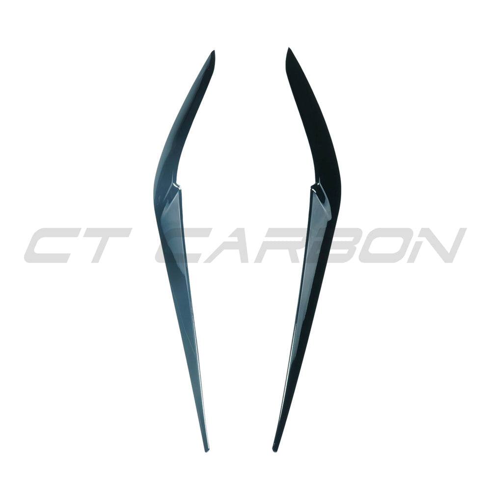 Black gloss headlight eyebrows and eyelids for BMW X5 G05 and F95 X5M, by CT Carbon, shown on vehicle with close-up view