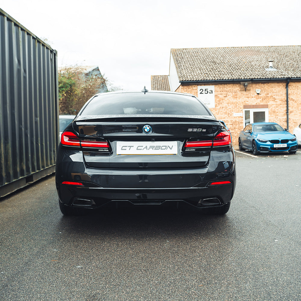 BMW 5 Series G30 V5 Gloss Black Spoiler by CT Carbon installed on the rear of the vehicle.