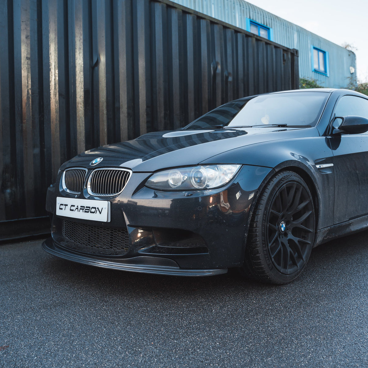 BMW M3 E92/E90 carbon fibre splitter V1 with detailed aerodynamic design, made by CT Carbon for sporty enhancement.