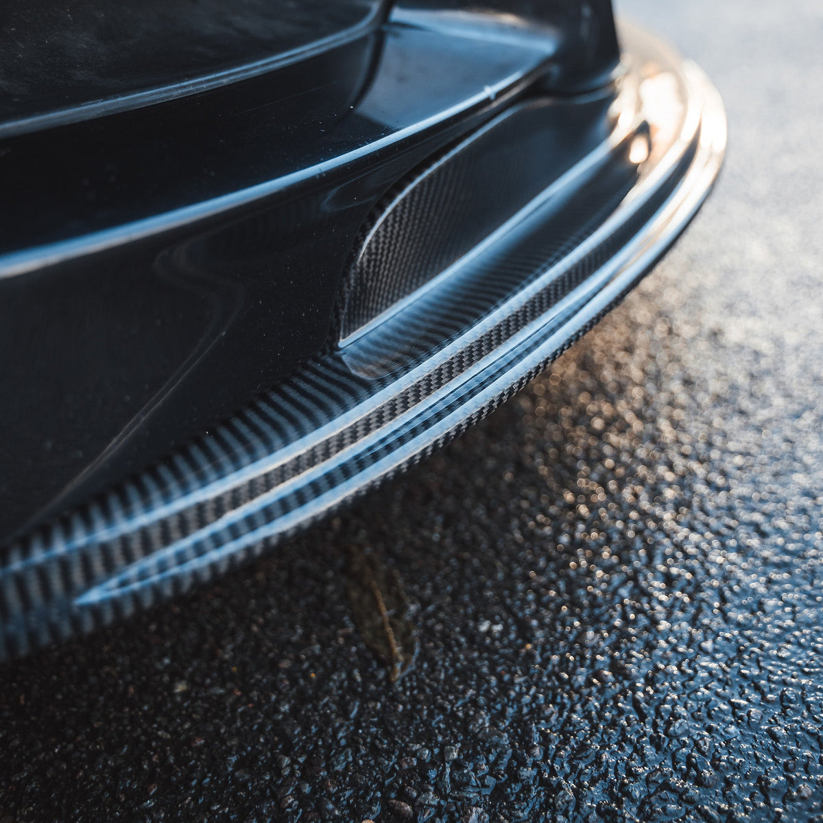 BMW M3 E92/E90 carbon fibre splitter V1 by CT Carbon, showcasing the sleek, aerodynamic design of the car accessory.