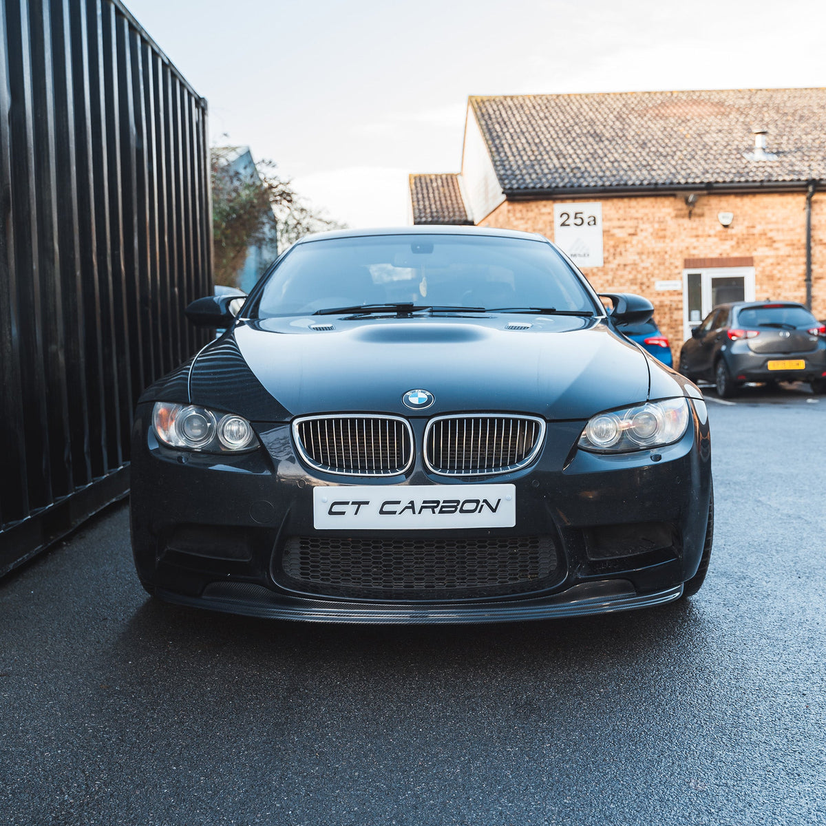 BMW M3 E92/E90 carbon fiber splitter V1 by CT Carbon, showing the sleek, aerodynamic front splitter design.
